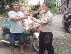 Polsek Lubuk Pakam Bagikan Bansos Kepada Masyarakat